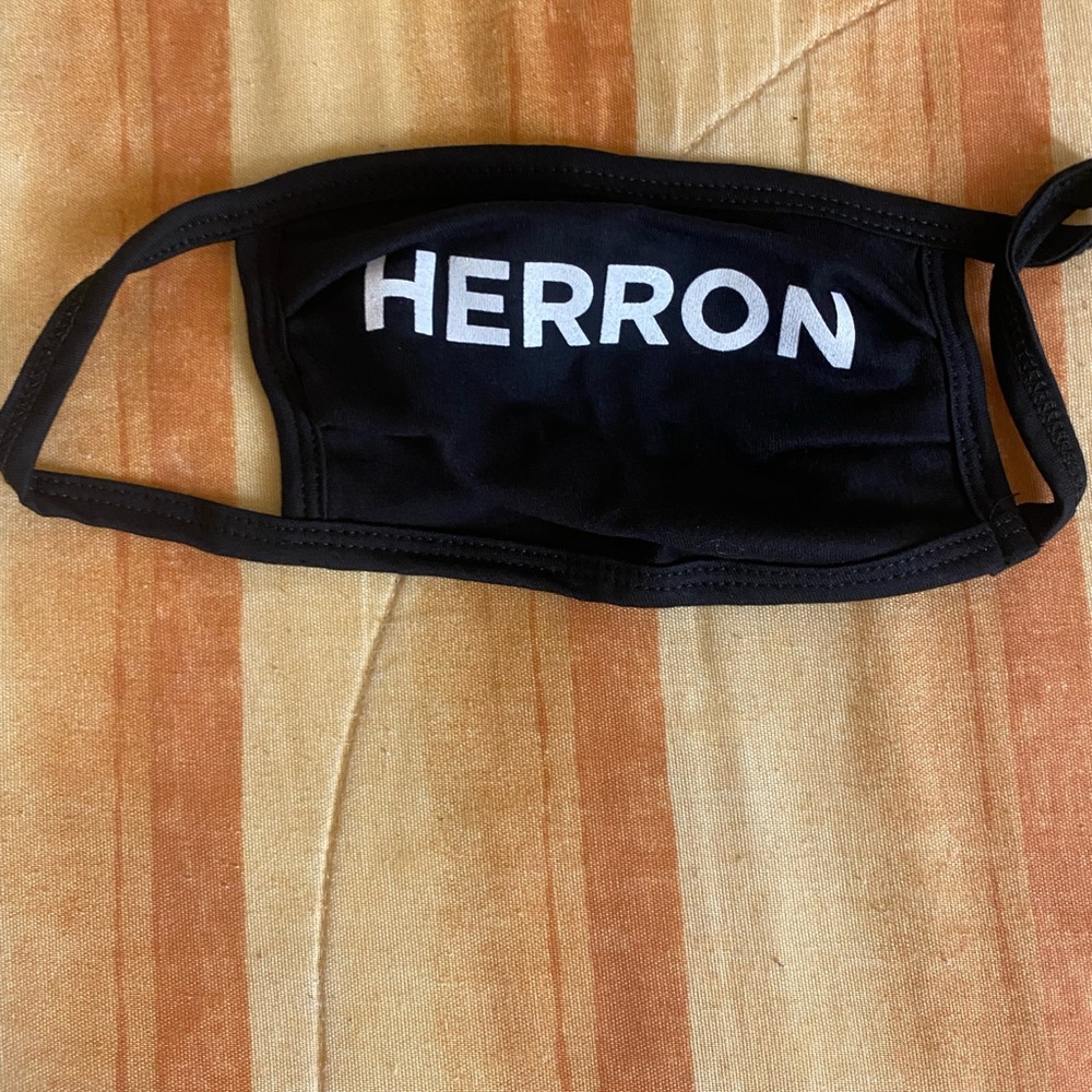 A Zach “HERRON” white and black face mask